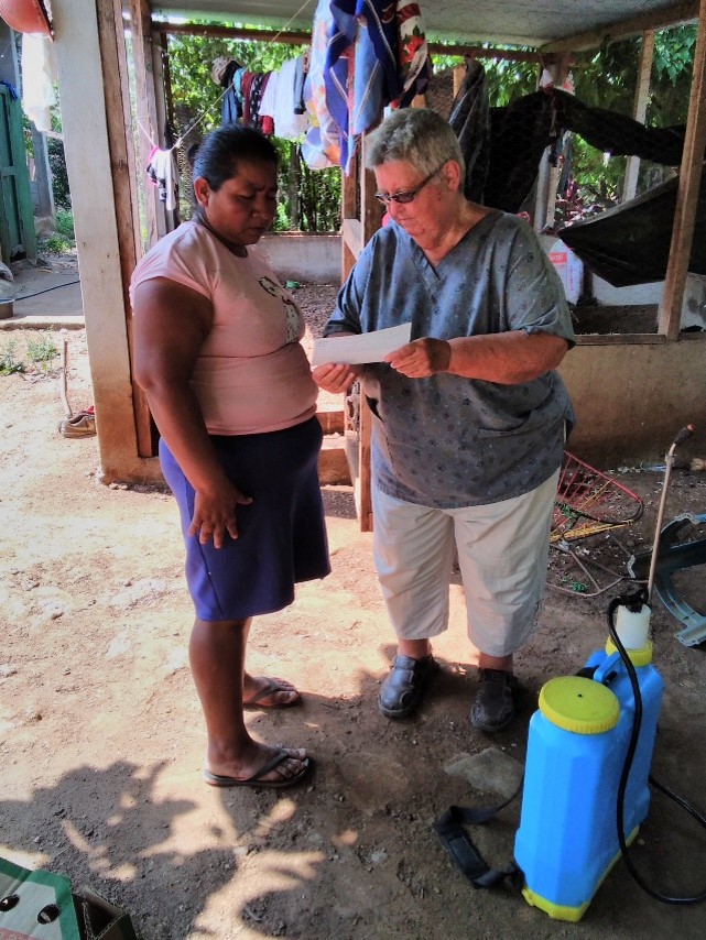 Sr. Dee Smith explaining the co-op savings scheme to a widow in Guatemala