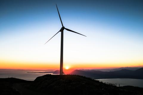 Wind turbine at sunset photo in public domain via unsplash