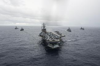 The USS Ronald Reagan, the USS Milius, the USS Chancellorsville, the Japanese ship Setogiri and the Australian ship Stalwart sail in formation in the Philippine Sea, Nov. 20, 2022.